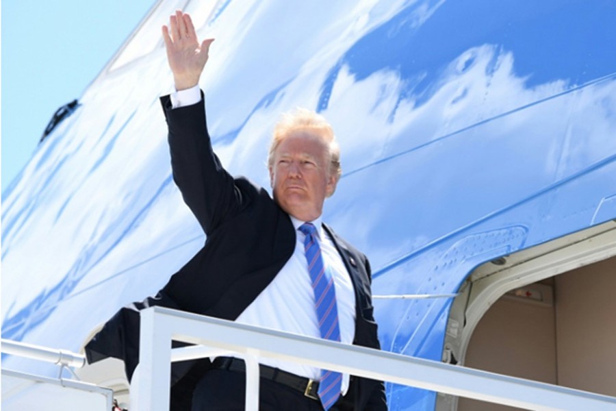 US President Donald Trump boards Air Force One to leave Canada after a contentious G7 summit on June 11. He lashed out at US allies in a Twitter rant on board the plane. — Photo: AFP