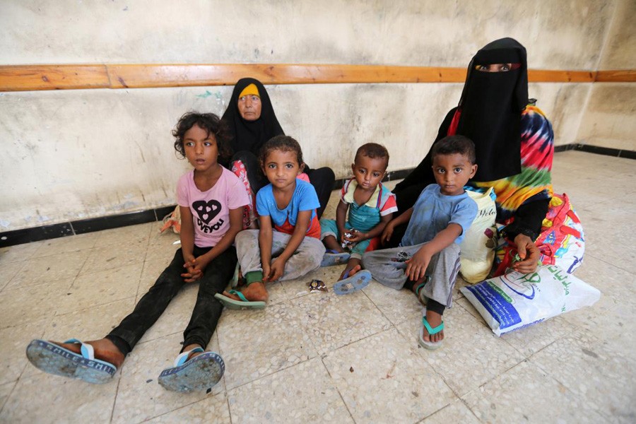 Family members sitting in a classroom of a school where they have been evacuated from a village near Hodeidah airport in Yemen on Monday — Reuters