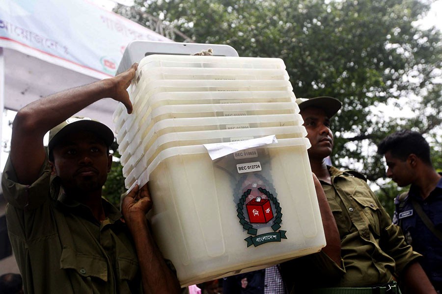 Ansar members carrying ballot boxes and other election materials (not in the frame) to a polling centre in Gazipur on Monday, a day before the Gazipur City Corporation election -Photo: Focus Bangla
