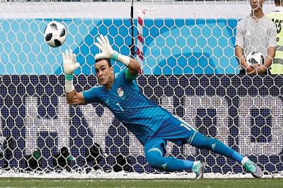 Egypt's 45 years and 161 days old goalkeeper Essam El-Hadary - who became the oldest player in FIFA World Cup history on Monday - saved a first-half penalty from Fahad Al-Muwallad of Saudi Arabia.