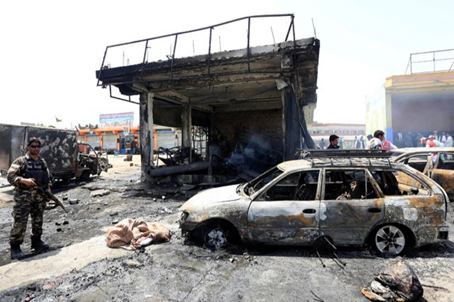 Afghan security forces inspecting the site of a suicide attack at Jalalabad city in Afghanistan recently — Reuters