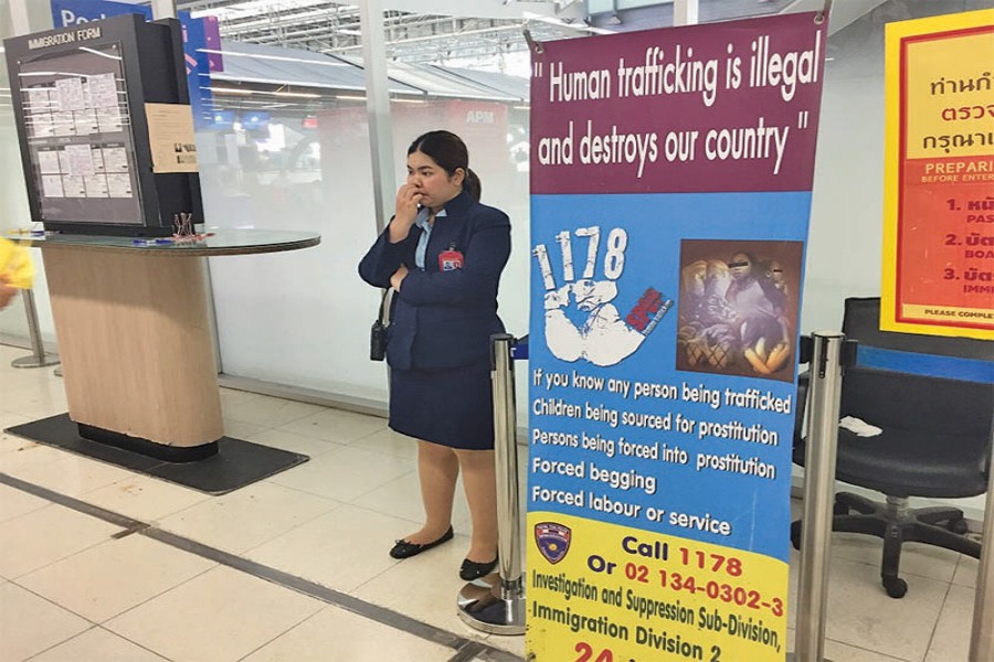 A banner with a message warning against human trafficking at Bangkok's main Suvarnabhumi Airport in Bangkok March 28, 2018. —Photo: Thomson Reuters Foundation