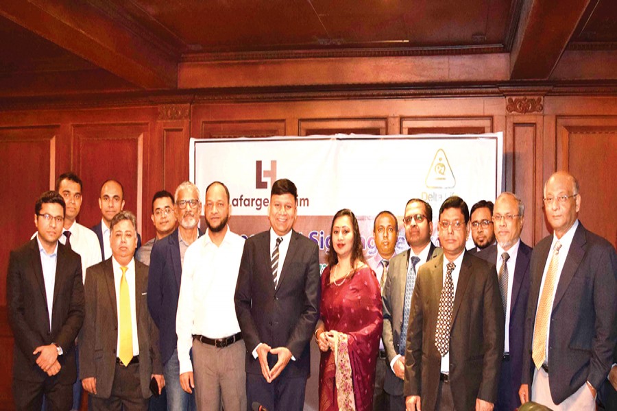 Rajesh K Surana, Chief Executive Officer, LafargeHolcim Bangladesh Limited and Ms. Adeeba Rahman, ACII (UK), Chief Executive Officer, Delta Life Insurance Company Limited seen in the agreement signing ceremony