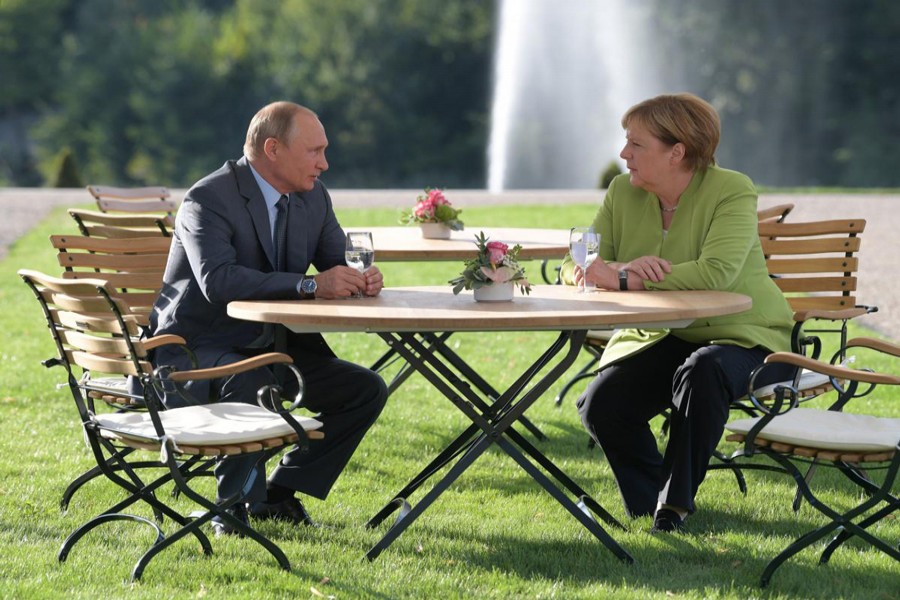 Russian President Vladimir Putin holding talks with German Chancellor Angela Merkel during their meeting at the German government guest house Meseberg Palace in Gransee, Germany on Saturday — Reuters