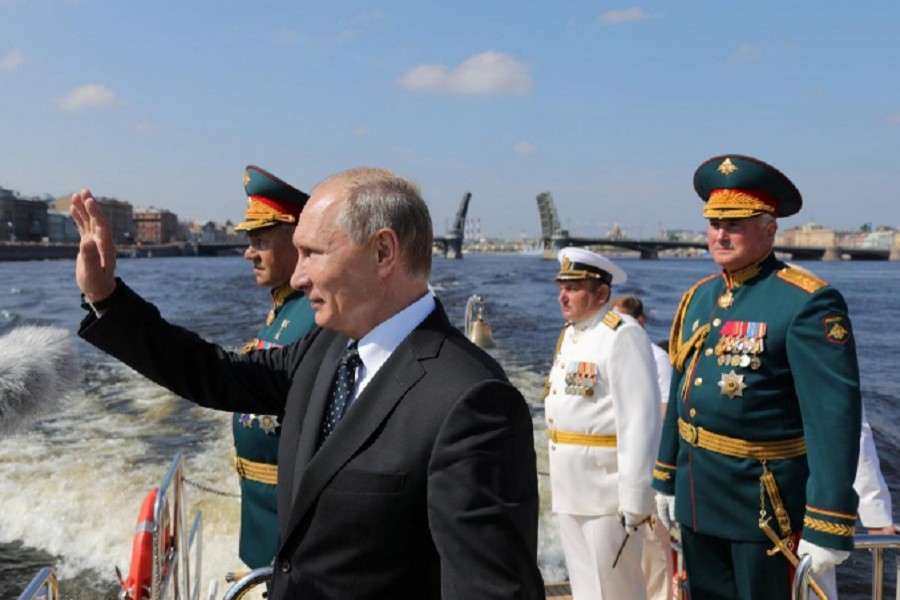 Russian President Vladimir Putin, Defence Minister Sergei Shoigu and Commander of Western military district Colonel-General Andrei Kartapolov attend the Navy Day parade in St. Petersburg, Russia July 29, 2018. - Reuters