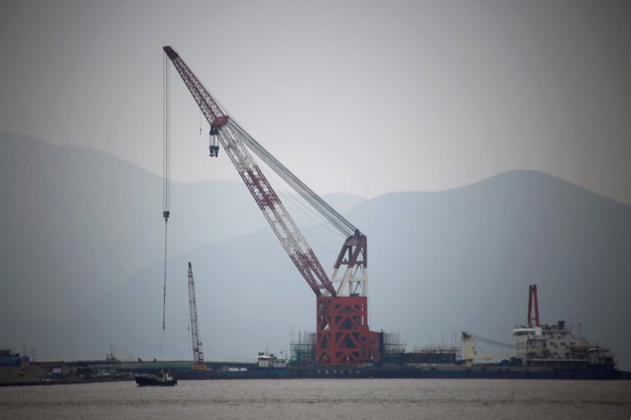 A crude oil terminal under construction is pictured off Ningbo Zhoushan port in Zhejiang province, China — Reuters