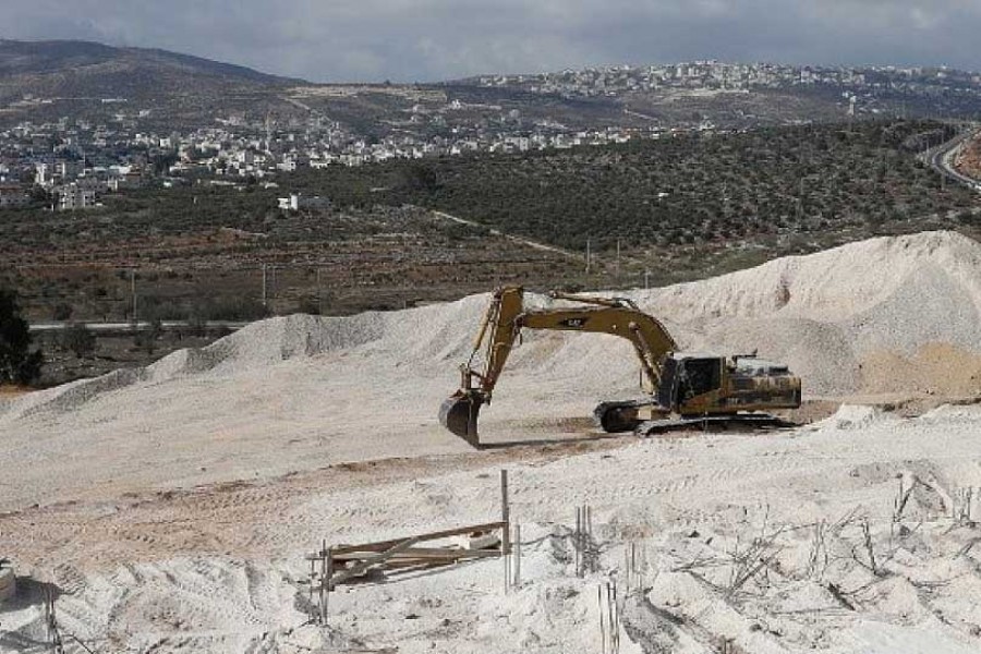 A CRANE IS USED AT THE CONSTRUCTION SITE IN THE WEST BANK SETTLEMENT OF AMICHAI ON SEPTEMBER 07, 2018: 25 years on, some Israeli right-wingers ready to declare Oslo accords dead. With settlers strengthening their hold on the West Bank and no prospects of peace on the horizon. —AFP