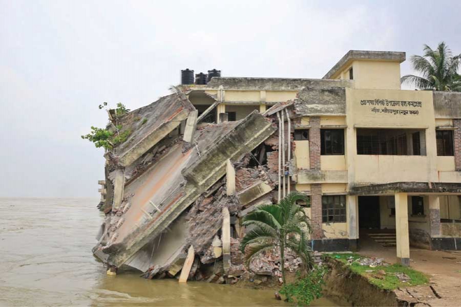 Naria Upazila Health Complex sinks as the Padma river erodes its banks in Shariatpur last week. — Photo: bdnews24.com