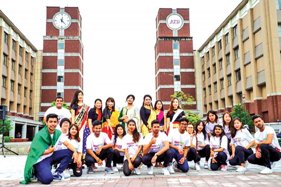 Some students and alumni of Ritsumeikan Asia Pacific University (APU) in Japan posing for a photo on Bangladesh Day