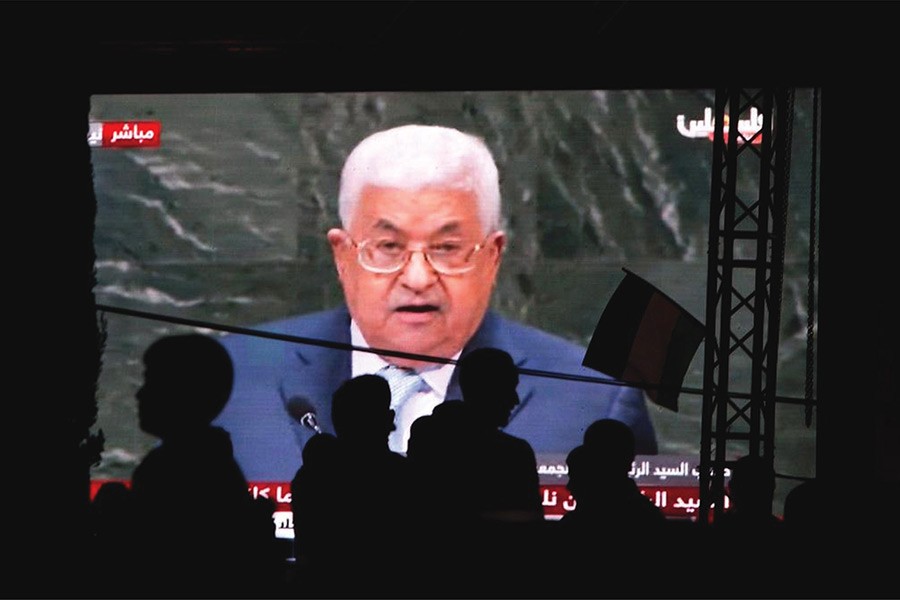 Palestinians watch a broadcast showing a speech by Palestinian President Mahmoud Abbas at the UN General Assembly on September 27, 2018 shown on TV in the West Bank city of Nablus. —Photo: AP