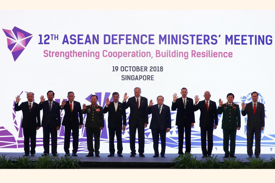 ASEAN defence ministers posing for a group photo at the ASEAN Defence Ministers' Meeting in Singapore on Friday — Reuters