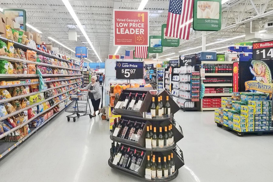 A file photo showing a shopper in the aisle of a Walmart store in Woodstock, Georgia, US — Reuters