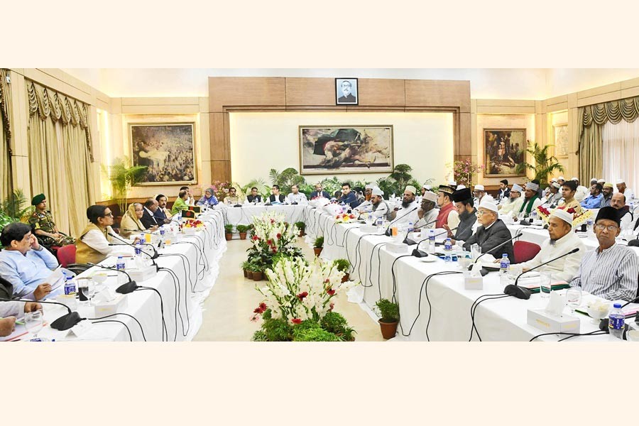 The 14-party alliance led by Prime Minister Sheikh Hasina holding talks with Islami Oikyajote, a coalition of eight Islamic parties, over upcoming election at Ganobhaban in the city on Tuesday — Focus Bangla