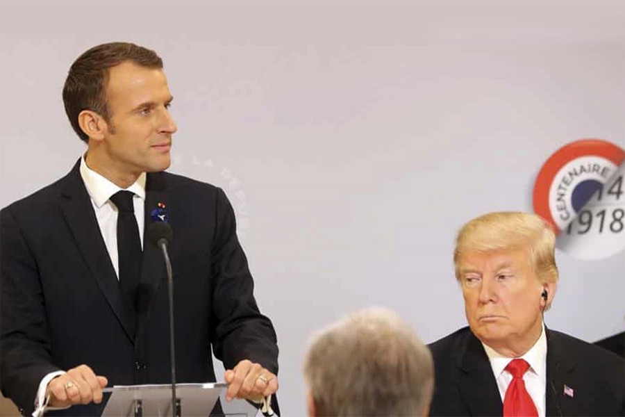 French President Emmanuel Macron delivers a speech while President Donald Trump looks on before a lunch at the Elysee Palace, in Paris, as part of the commemorations marking the 100th anniversary of the 11 November 1918 armistice, ending World War I on November 11: 'Nationalism is a betrayal of patriotism,' says Macron as if as a rebuke to President Trump — Photo: AP