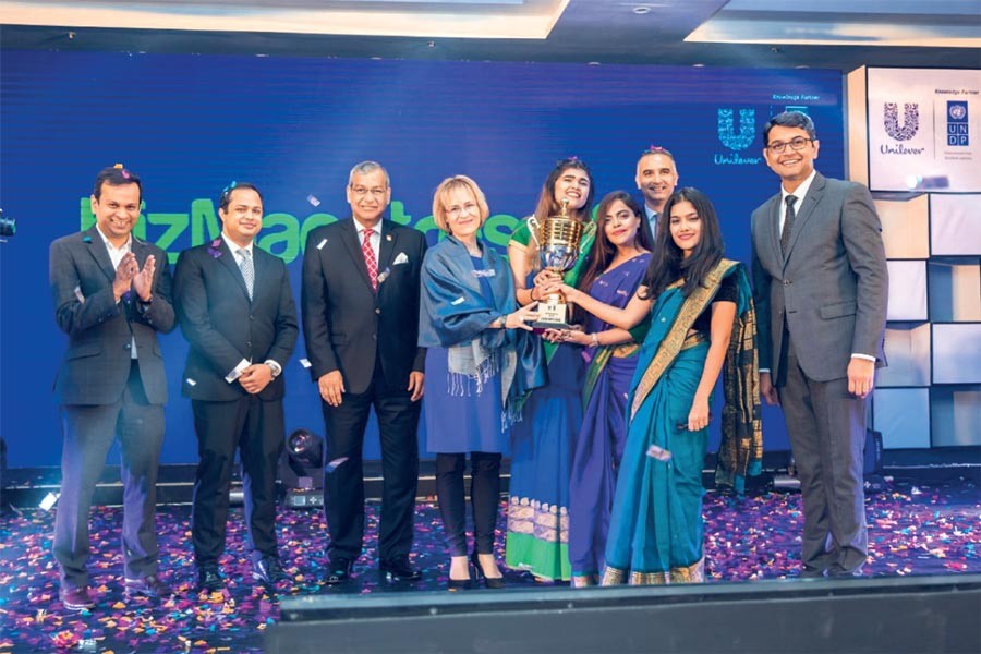 Students of BUP after receiving the trophy and ticket to the global round from the guests—CEO and Managing Director of Unilever Bangladesh Limited Kedar Lele, UN Resident Coordinator and UNDP Resident Representative, Bangladesh Mia Seppo and others