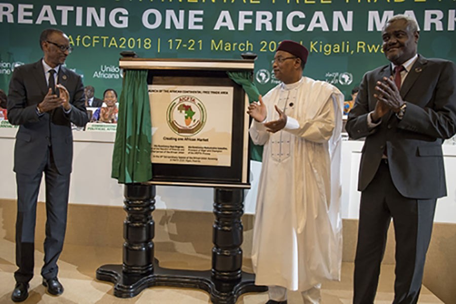 (From left) African Union chairperson and president of Rwanda Paul Kagame, president of Niger Mahamadou Issoufou and African Union Commission chairperson Moussa Faki Mahamat at the launch of AfCFTA in Kigali in March 2018. — Office of President Paul Kagame