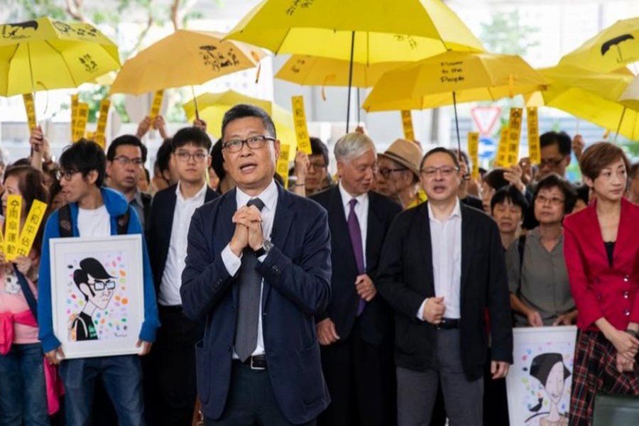 HONG KONG: Hundreds of supporters joining the nine accused activists outside the court on Monday — EPA