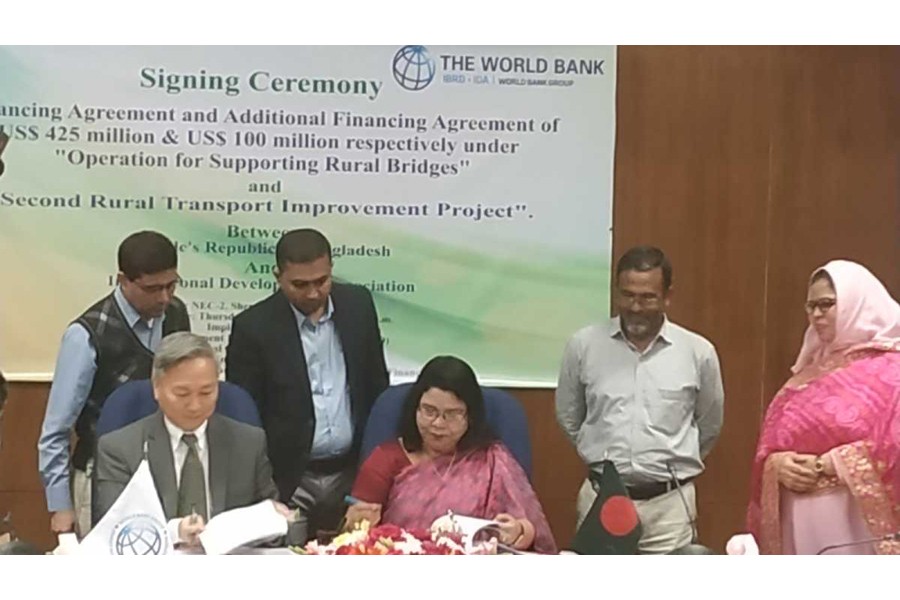 Mahmuda Begum, Additional Secretary of Economic Relations Divisions (ERD), and Quimiao Fan, World Bank Country Director for Bangladesh, Bhutan and Nepal, signing deals at ERD in the city on Thursday -UNB photo
