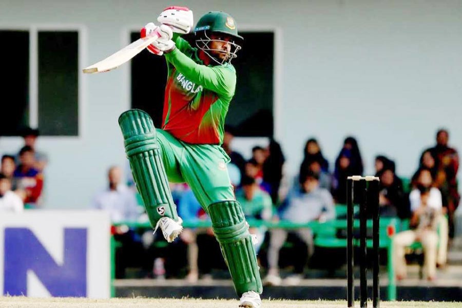 Tamin Iqbal hitting the ball against a West Indies bowler during the prequel match to the three-match one-day International series at BKSP in Savar on Thursday — UNB