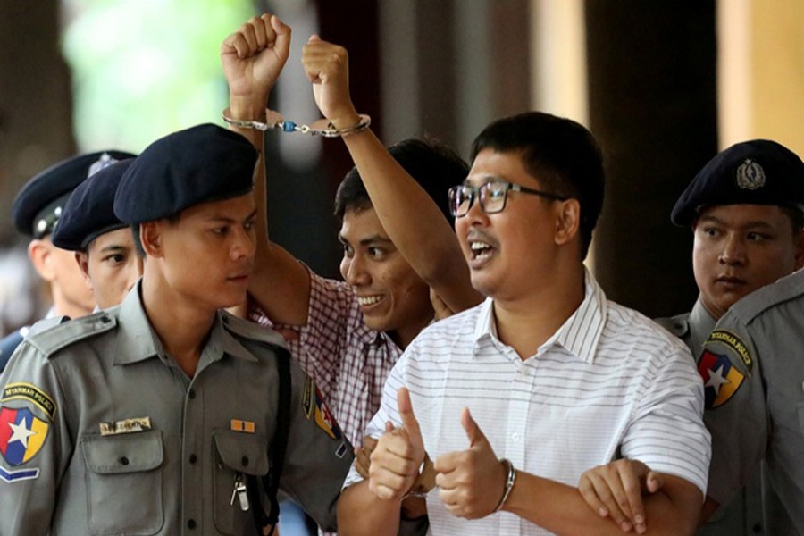 Detained Reuters journalist Wa Lone and Kyaw Soe Oo arrive at Insein court in Yangon, Myanmar August 27, 2018. Reuters/Files