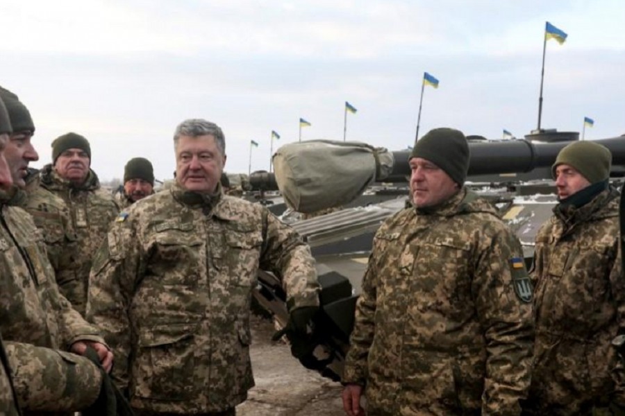 Ukraine's President Petro Poroshenko (3rd R) attends a ceremony to hand over weapons and military vehicles to servicemen of the Ukrainian armed forces at an airforce base near Zhytomyr, Ukraine on December 21, 2018. - Reuters
