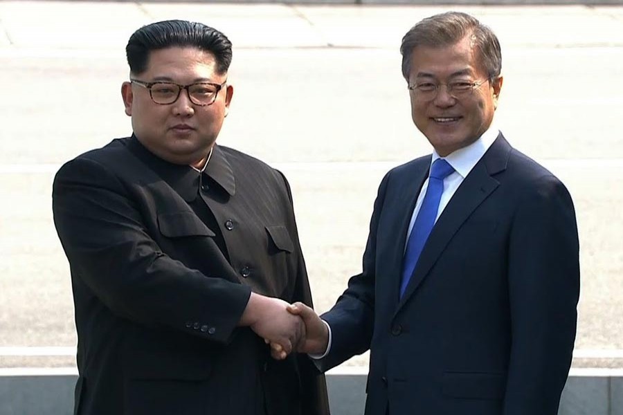 North Korean leader Kim Jong Un and South Korean President Moon Jae-in shaking hands ahead of talks during a historic summit on April 27, 2018 — File photo