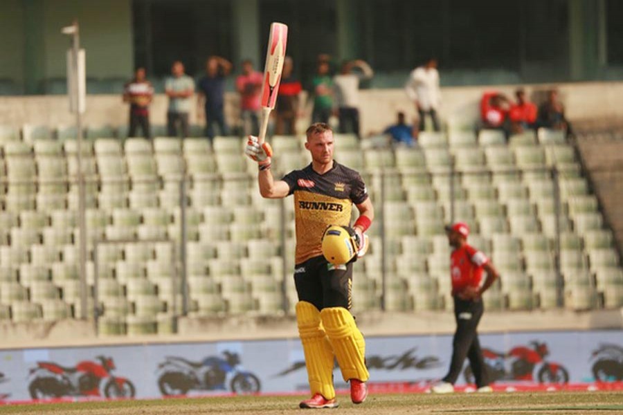 Rajshahi Kings' Laurie Evans celebrating after hitting a century against Comilla Victorians in BPL at Sher-e-Bangla National Cricket Stadium in the city on Monday — bdnews24.com