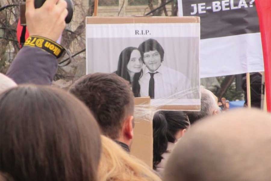 A protester in the Slovak capital, Bratislava holds up a picture of murdered journalist Jan Kuciak and his fiancée Martina Kusnirova. —Ed Holt/IPS