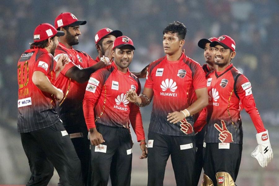 Comilla Victorians' Mohammad Saifuddin celebrating with his teammates after getting a wicket against Dhaka Dynamites in the BPL match at Sher-e-Bangla National Cricket Stadium in the city on Friday — bdnews24.com