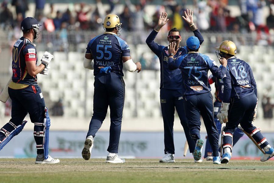 Dhaka Dynamites' West Indies spinner Sunil Narine celebrating after taking a wicket during the Bangladesh Premier League match against Chittagong Vikings at the Sher-e-Bangla National Stadium in the city on Monday — bdnews24.com