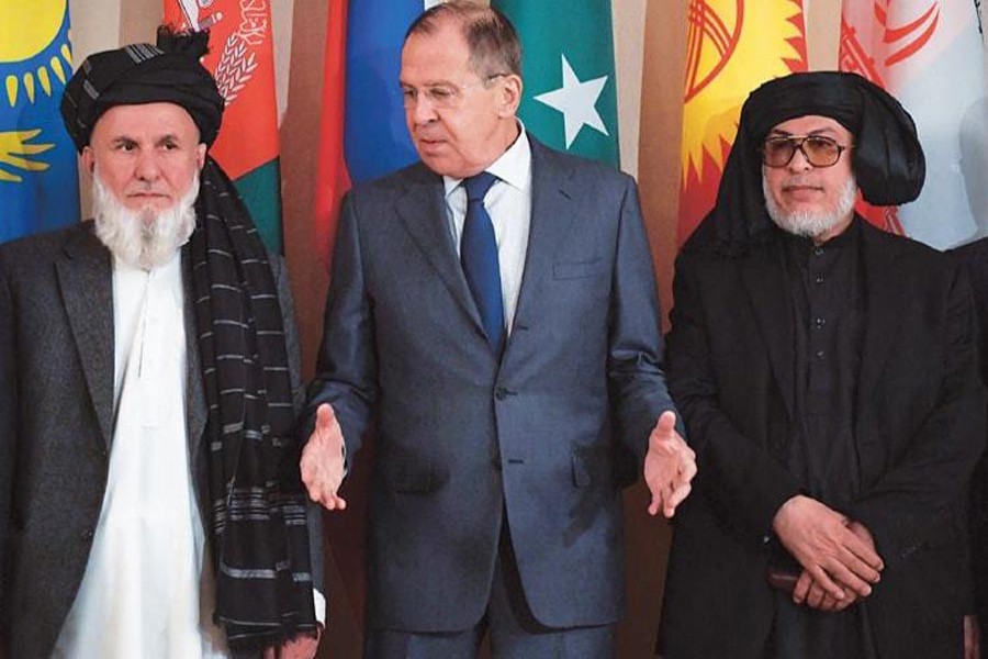 Russian Foreign Minister Sergei Lavrov posing for photo with representatives of Afghan government and Taliban before talks --Internet