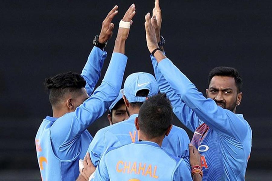 India's Krunal Pandya celebrating with teammates after taking the wicket of New Zealand's Colin Munro during the 2nd T20 international match at Eden Park in Auckland on Friday — AP