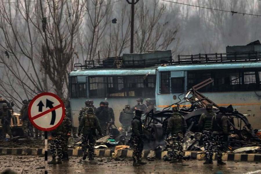 Security personnel carry out rescue and relief operations on the Jammu-Srinagar highway after the deadly terror attack on February 14, 2019. —Photo by PTI
