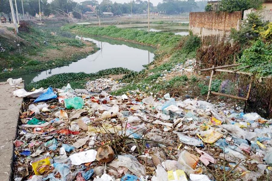 A pile of wastes near the Chilai river in Gazipur — UNB Photo