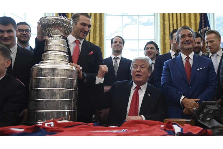 Donald Trump, fresh from declaring himself completely exonerated by the Mueller inquiry, hosts the 2018 Stanley Cup champion Washington Capitals in the Oval Office on March 25, 2019. —Photo: AP