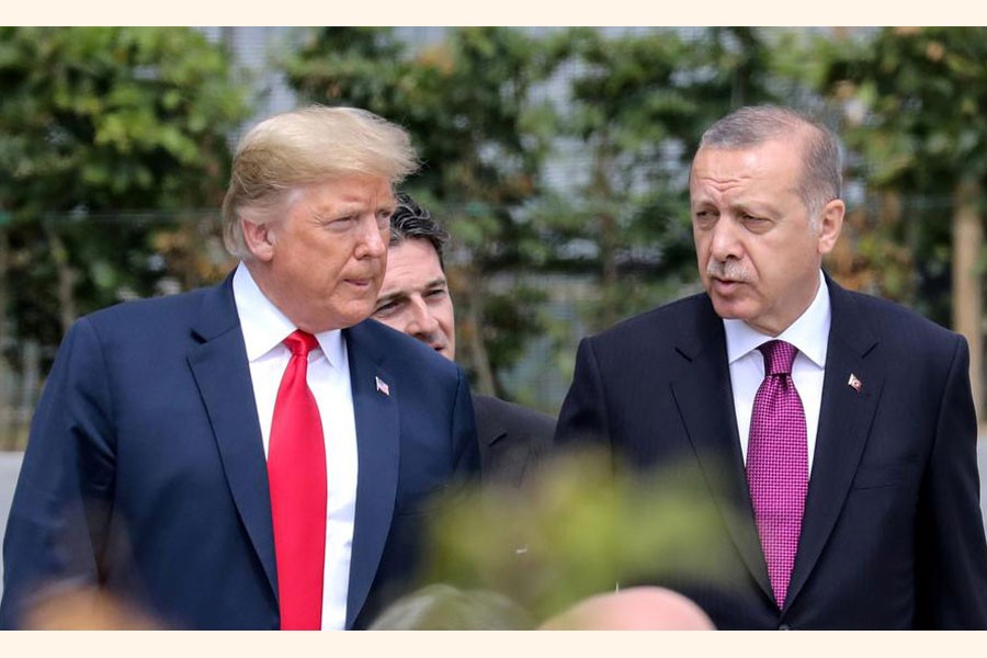 A file photo showing US President Donald Trump (left) talking with Turkey's President Tayyip Erdogan during the opening ceremony of the NATO (North Atlantic Treaty Organisation) summit, at the NATO headquarters in Brussels, Belgium recently — Reuters