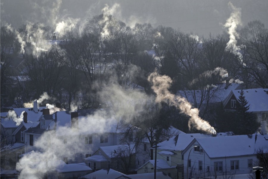 In this January 30, 2019, file photo smoke rises from the chimneys of homes in St. Paul, Minnesota. Americans burned a record amount of energy in 2018, with a 10 per cent jump in consumption from booming natural gas helping to lead the way, the US Energy Information Administration says. Overall consumption of all kinds of fuels rose 4.0 per cent year on year, the largest such increase in eight years, a report from the agency said. Fossil fuels in all accounted for 80 per cent of Americans' energy use. —Photo: AP