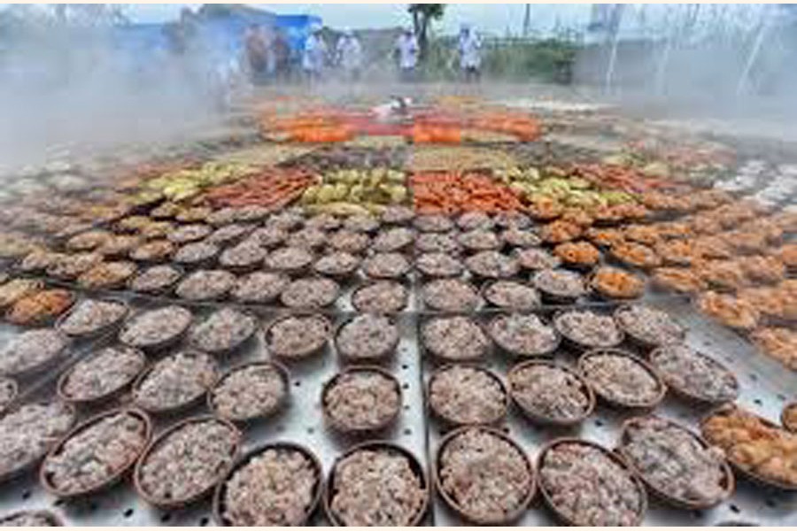 Steamed dishes are seen on a giant food steamer for an event at a tourist attraction in Xiantao, Hubei province, China — Reuters