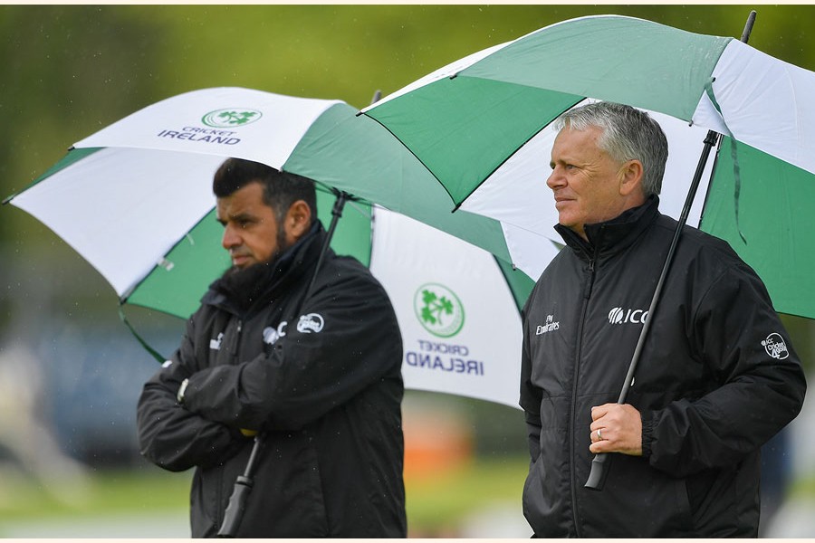 Umpires Aleem Dar and Mark Hawthorne taking shelter from the rain during the ODI match between Bangladesh and Ireland in Malahide on Thursday — Internet