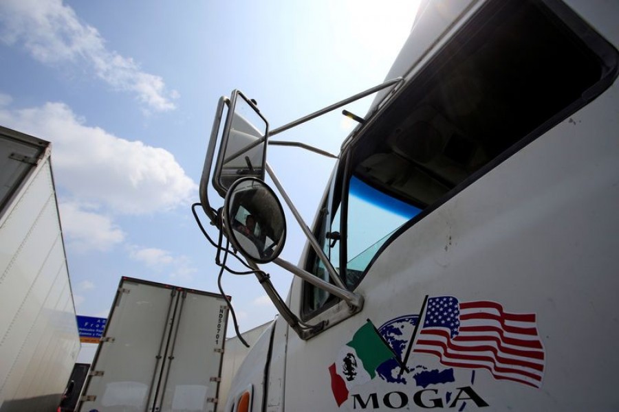 Trucks wait in a long queue for border customs control to cross into US at the World Trade Bridge in Nuevo Laredo, Mexico, April 6, 2019. Reuters/Files