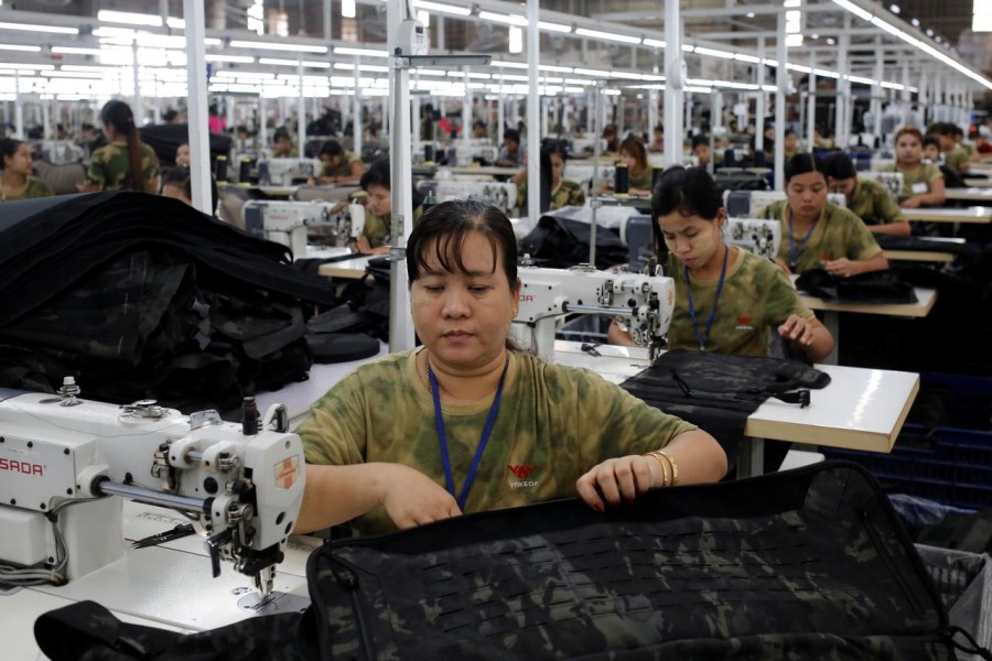Workers assemble products at a factory owned by Yakeda Outdoor Travel Products Co. LTD in Yangon, Myanmar, June 11, 2019. Reuters/Files