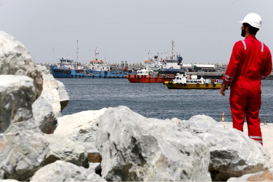 A technical staffer is seen at the Port of Fujairah, United Arab Emirates — Reuters