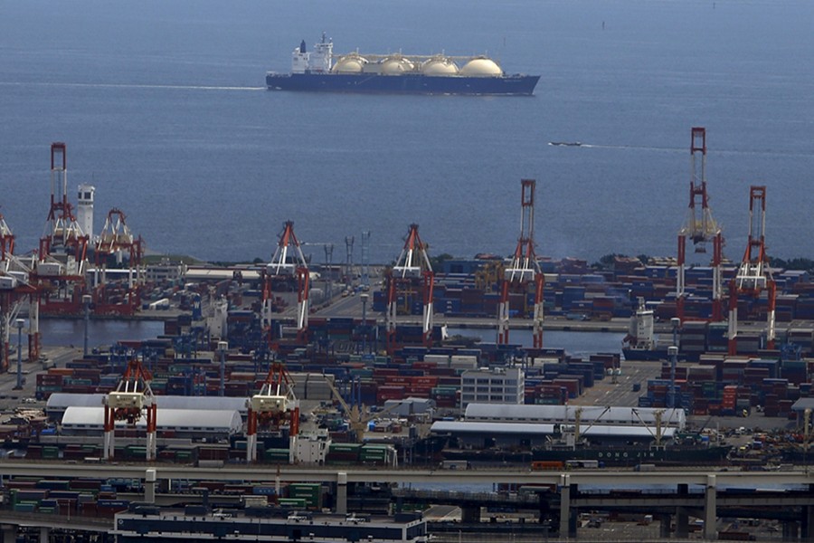 A LNG (Liquefied Natural Gas) tanker is seen behind a port in Yokohama, south of Tokyo, Japan on September 4, 2015 — Reuters/Files