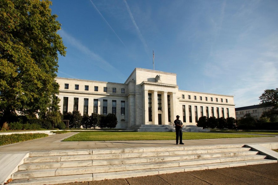A police officer keeps watch in front of the US Federal Reserve building in Washington, DC, US on October 12, 2016. Reuters/File Photo
