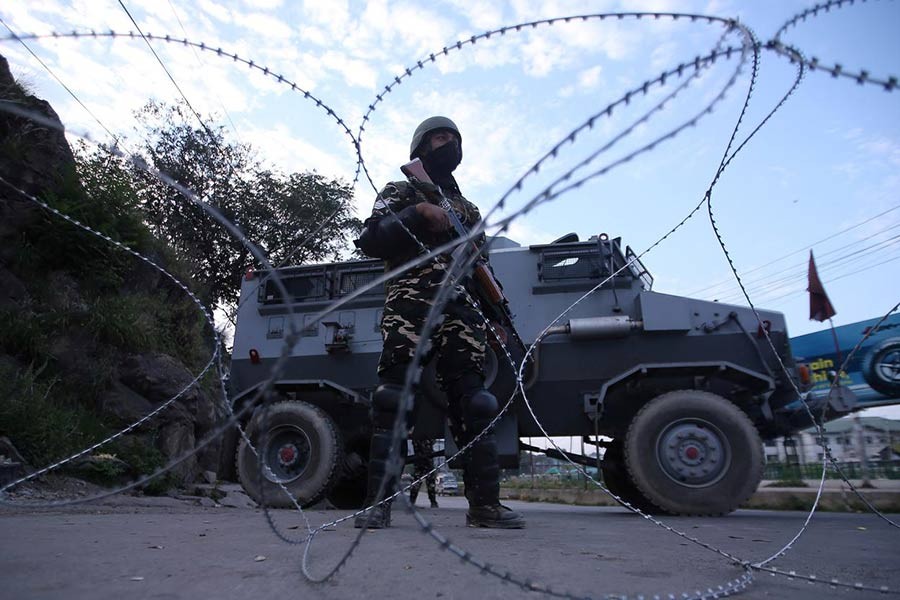 An Indian security personnel stands guard on a deserted road during restrictions after scrapping of the special constitutional status for Kashmir by the Indian government, in Srinagar, August 23, 2019. -Reuters photo