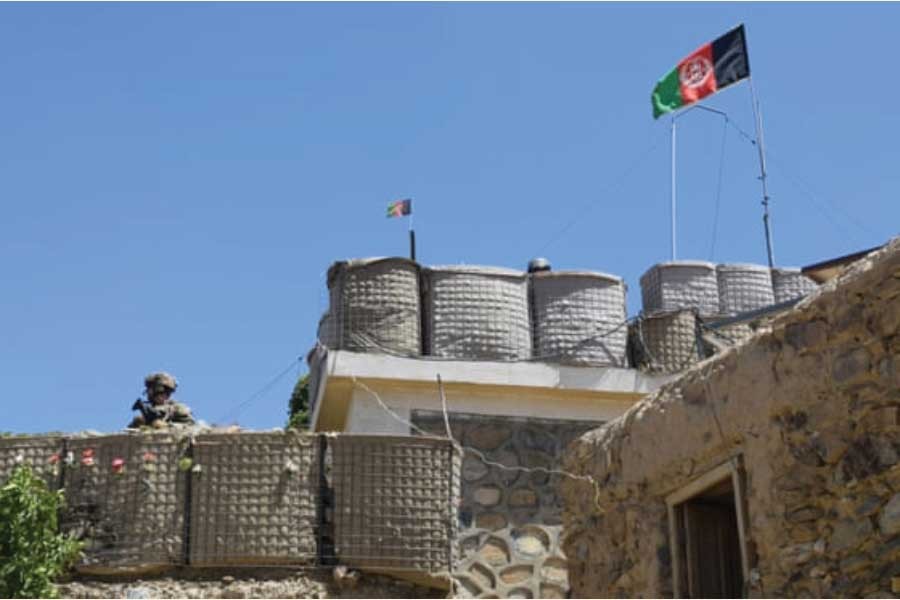 A US adviser stands at the fortification of a base during deployment to Afghanistan in June 2019. The collapse of protracted US-Taliban negotiations has triggered fears of a spike in violence. —Photo: Handout/Reuters