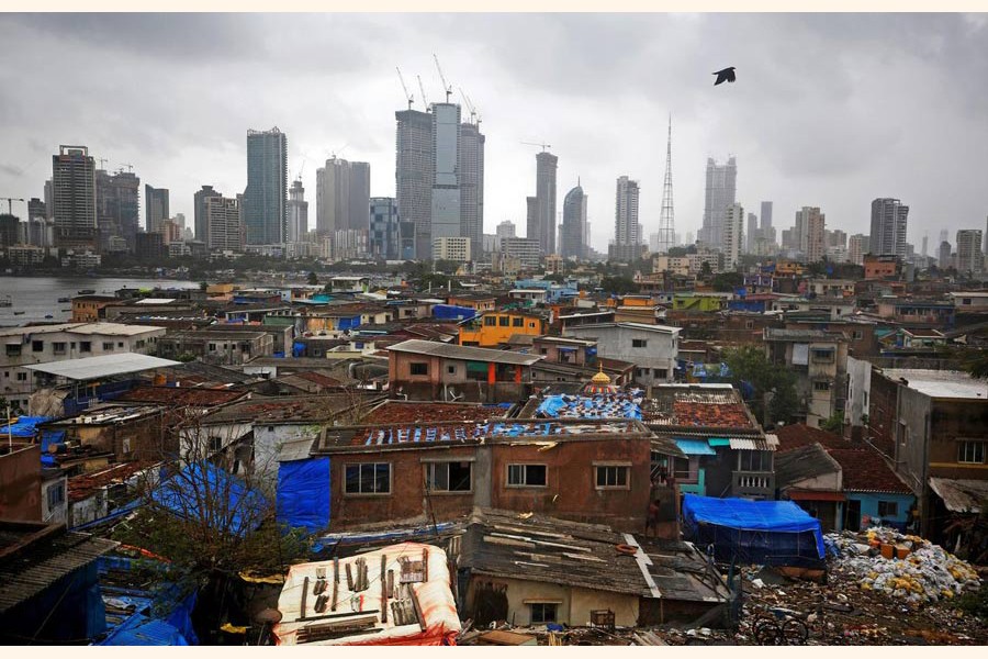 A file photo showing a bird flies across central Mumbai's financial district skyline, India — Reuters