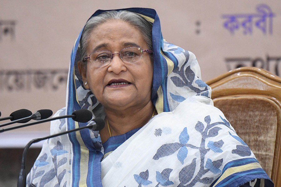 Prime Minister Sheikh Hasina addressing a ceremony at her office on Thursday — Focus Bangla photo