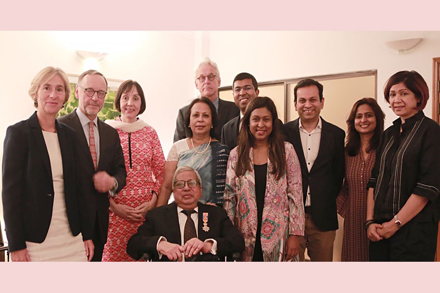 Sir Fazle Hasan Abed receives the insignia of the Royal Knighthood bestowed upon him by Harry Verweij, Dutch Ambassador to Bangladesh, in the city on Wednesday