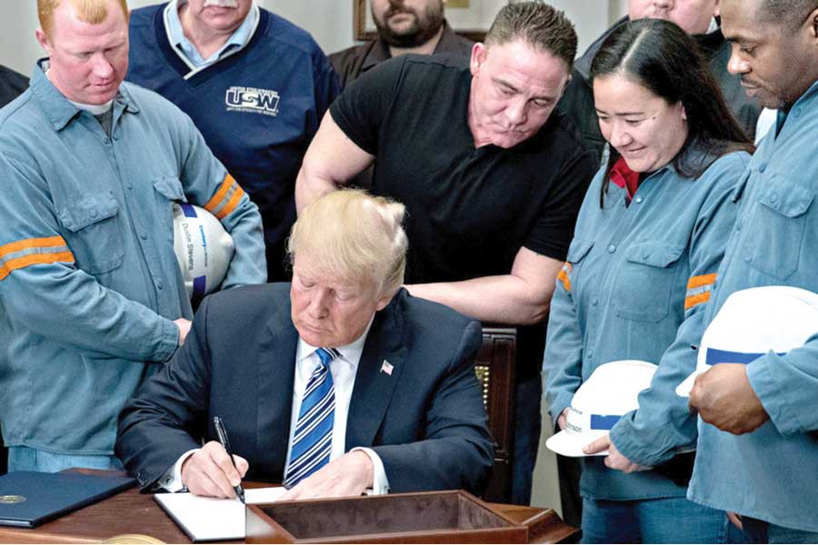President Donald Trump signs the proclamation on steel imports on March 08, 2018. —Photo: AP